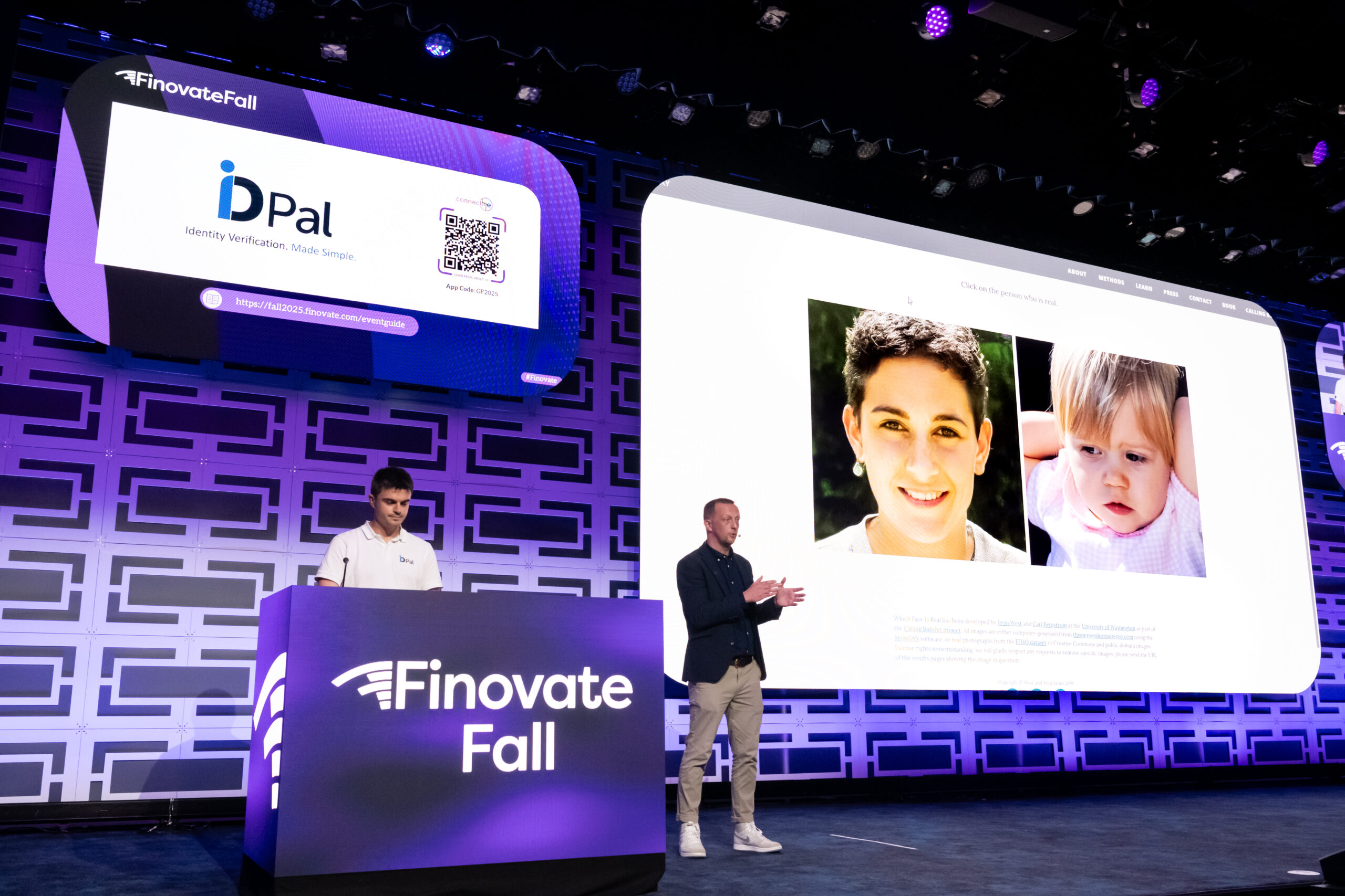 Two presenters from ID-Pal demonstrate their identity verification technology on stage at FinovateFall. One person stands at a podium with the Finovate Fall logo and an ID-Pal banner on the screen behind him, while the other speaks beside a large display showing two photos used in the demo. The stage backdrop features a blue and purple geometric pattern with event lighting.